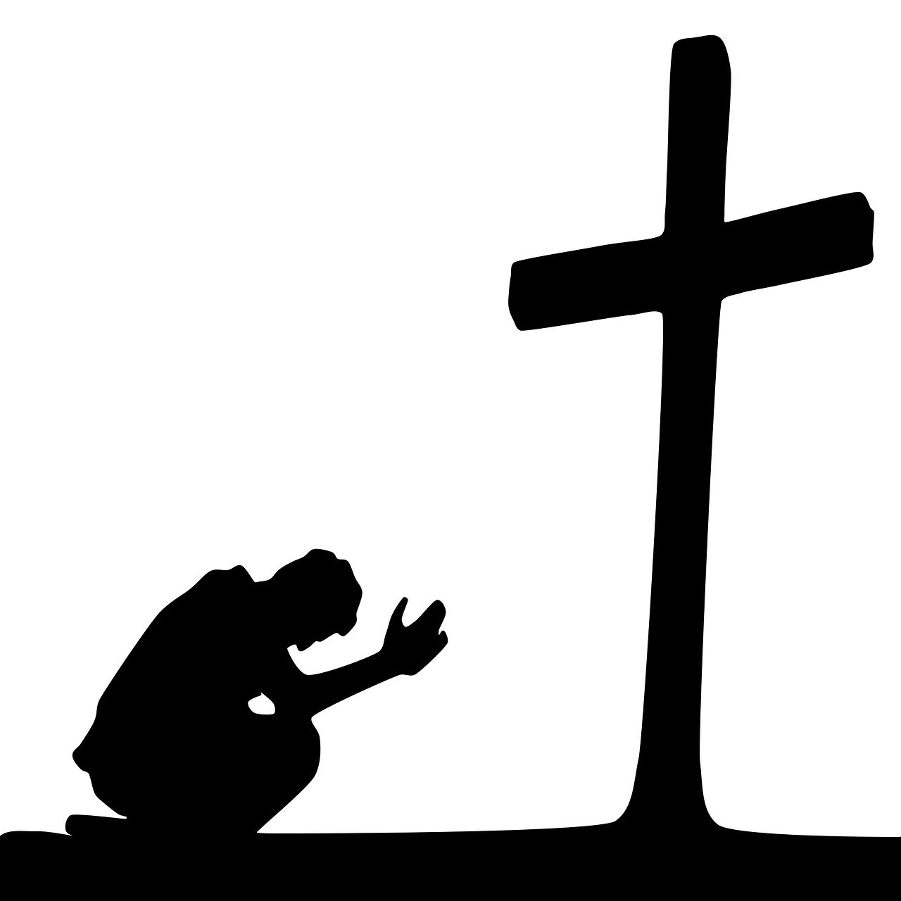 Black and white image of man kneeling before a cross